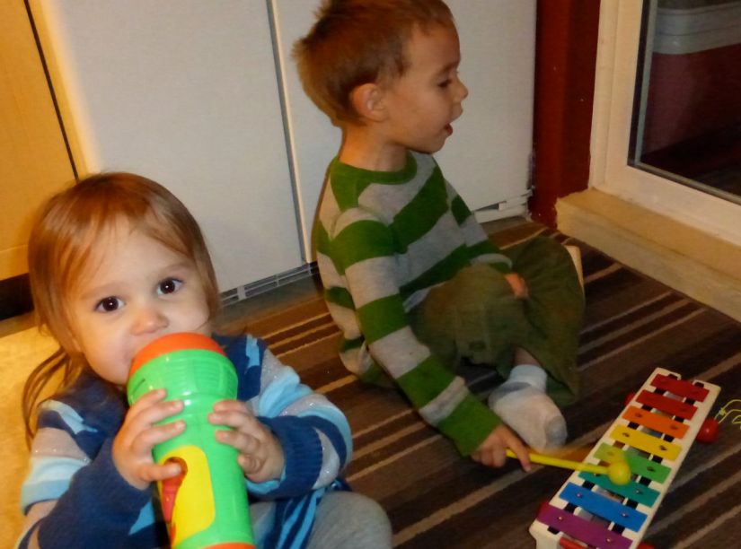 Children playing with microphone and xylophone